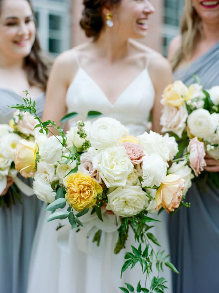Bride with bouquet and bridesmaids