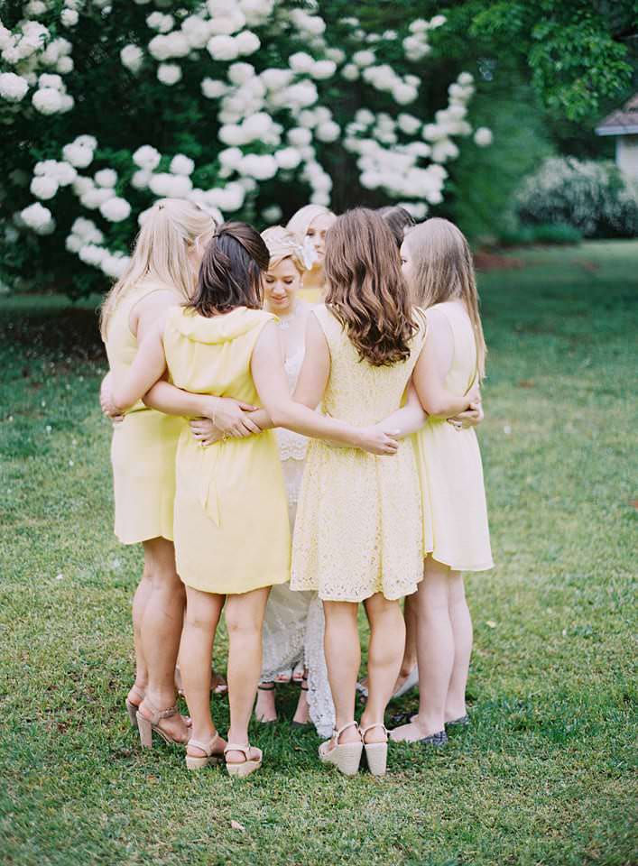 wedding day bridesmaids dressed in yellow