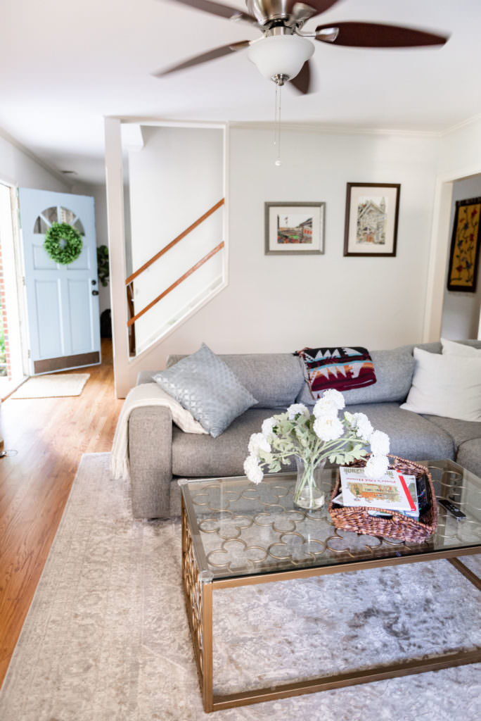 Living room, couch, coffee table with white flowers