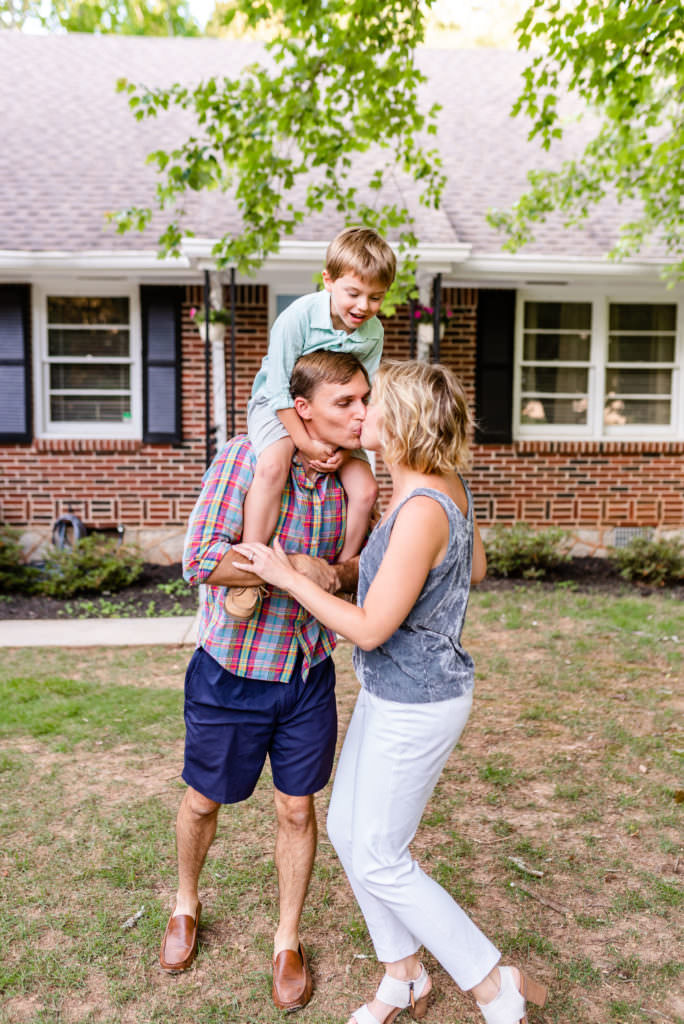 Family, Chris and Sarah Chancey with Boaz on Chris's shoulders outside their Atlanta Home