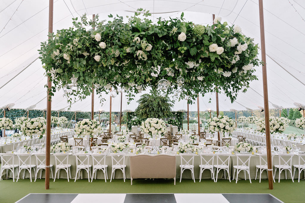 Stunning wedding design, wedding florals stung above white wedding table and chairs